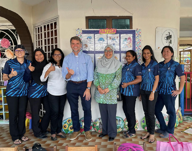 Tony Gentry, Ph.D., professor emeritus in the VCU College of Health Professions, with Nursuriati Jamil, a computer science professor who hosted him during his Fulbright, and the teachers at the National Autism Society of Malaysia (NASOM) treatment clinic, in Clang, Malaysia. (Contributed photo)